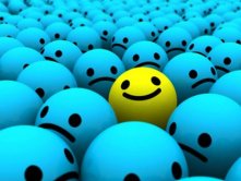 A smiley face standing out from the crowd