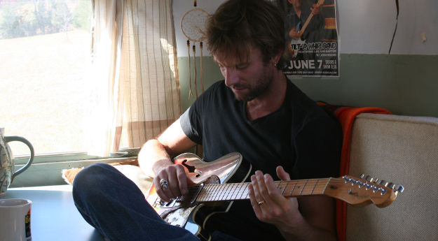 Josh Rogan playing his Fender guitar.