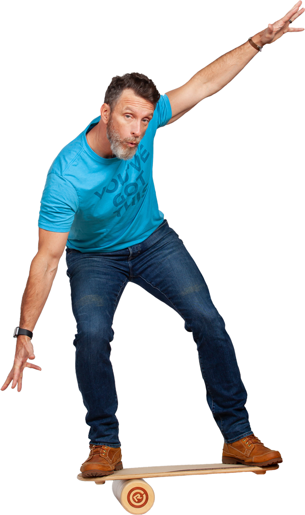 Mike Michalowicz balancing on a balance board